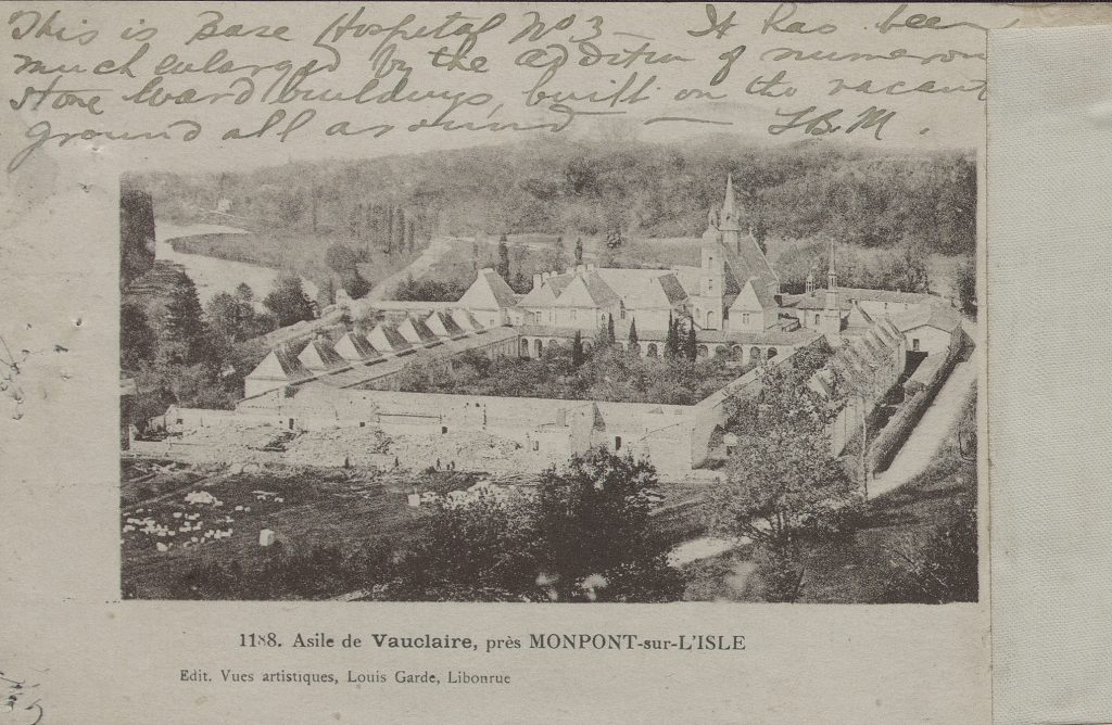 Postcard showing 14th-century gated monastary with garden at center